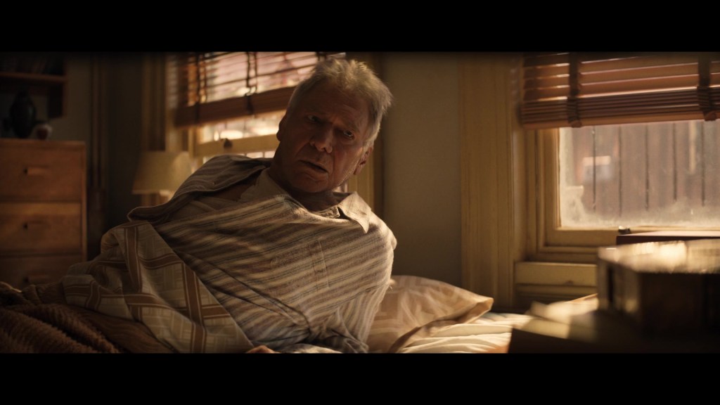 Indy (Harrison Ford) awakens in the present after being knocked out by Helena (Phoebe Waller-Bridge) to let him stay in the past in Indiana Jones and the Dial of Destiny (2023), Lucasfilm