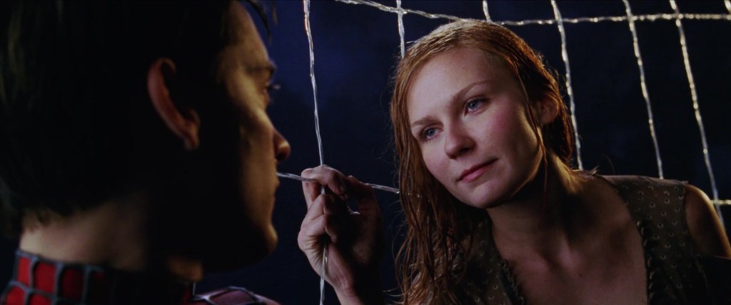 Mary-Jane Watson (Kirsten Dunst) learns the truth behind Peter Parker's (Tobey Maguire) double life in Spider-Man (2002), Sony