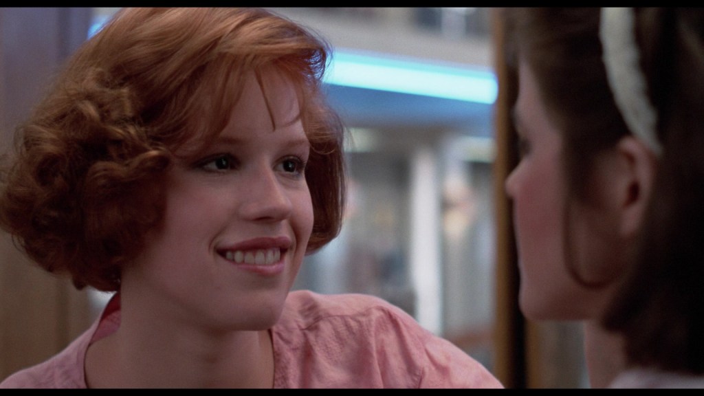 Claire (Molly Ringwald) helps Allison (Ally Sheedy) with her make-up in The Breakfast Club (1985), Universal Pictures