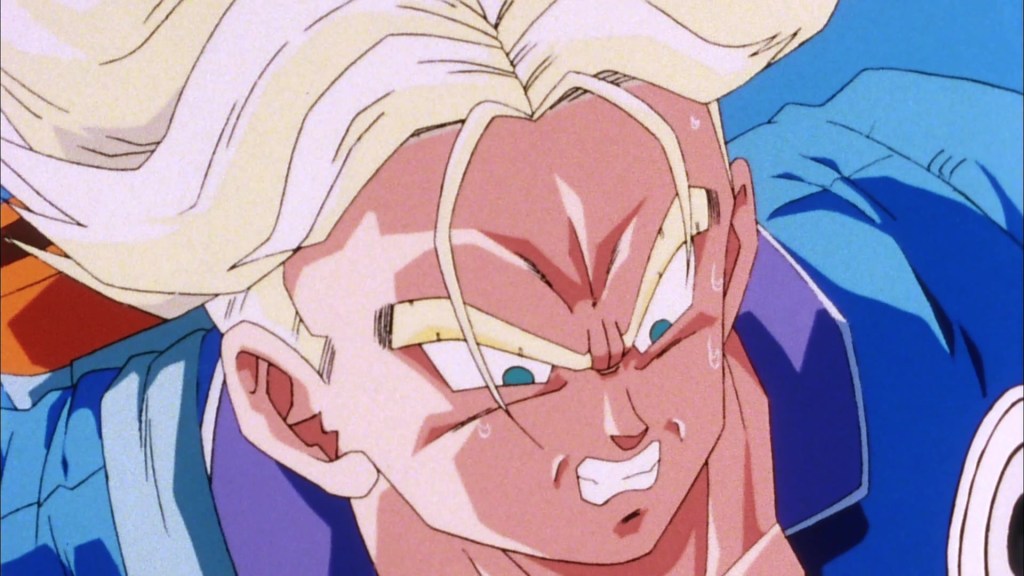 Trunks (Takeshi Kusao) finds his Super Saiyan powers are still no match for the combined might of Androids 17 (Shigeru Nakahara) and 18 (Miki Ito) in Dragon Ball Z: The History of Trunks (2000), Toei Co. Ltd.