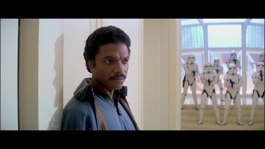 Lando Calrissian (Billy Dee Williams) turns the rebels over to Darth Vader (James Earl Jones) in Star Wars Episode V: The Empire Strikes Back (1980), Lucasfilm