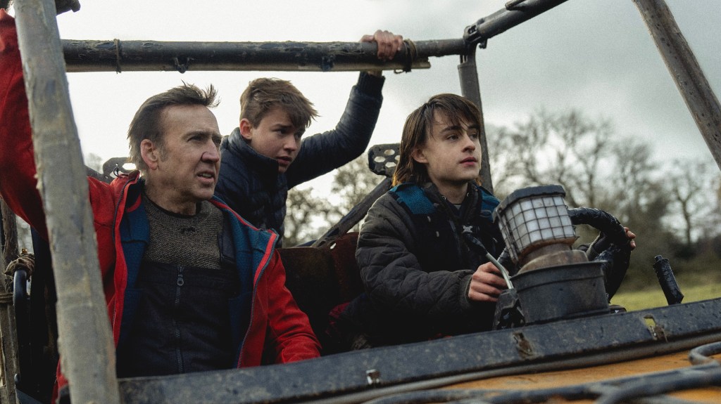 (From L to R) Nicolas Cage, Maxwell Jenkins, and Jaeden Martell as Paul, Thomas, and Joseph in the action horror film Arcadian. Image property of RLJE Films.
