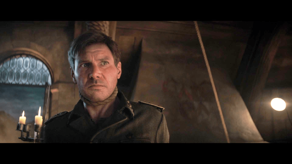 A digitally de-aged Indy (Harrison Ford) faces execution at the hands of the Third Reich in Indiana Jones and the Dial of Destiny (2023), Lucasfilm