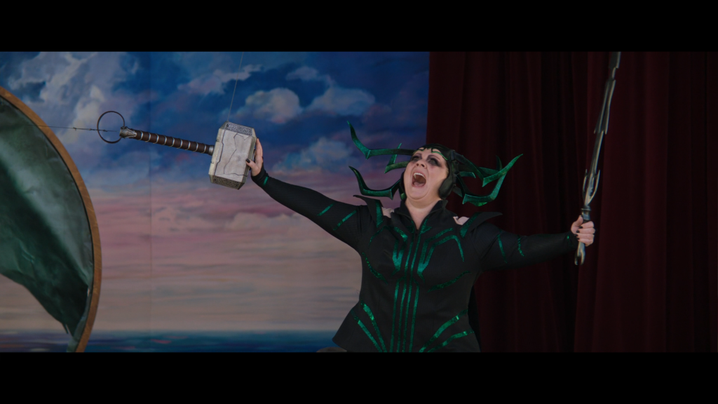 Hela (Melissa McCarthy) prepares to shatter Mjolnir in Thor: Love and Thunder (2022), Marvel Entertainment