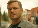 Jack (Alan Ritchson) takes notice of a less-than-savory character in Reacher Season 2 Episode 1 "ATM" (2023), Amazon