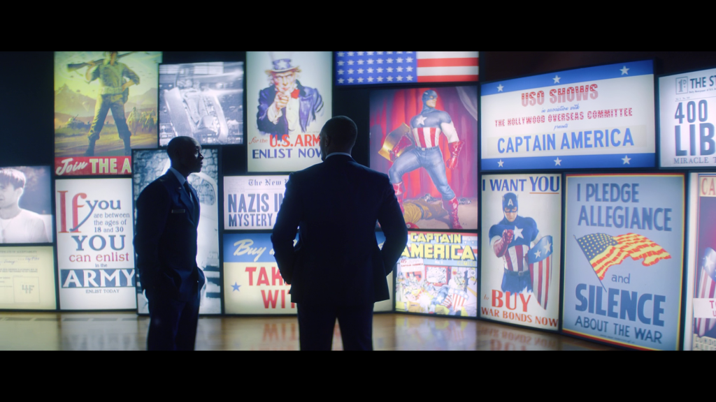 Sam Wilson (Anthony Mackie) and James Rhodes (Don Cheadle) reflect on the legacy of Captain America (Chris Evans) in Falcon and the Winter Soldier Season 1 Episode 1 "New World Order" (2021), Marvel Entertainment