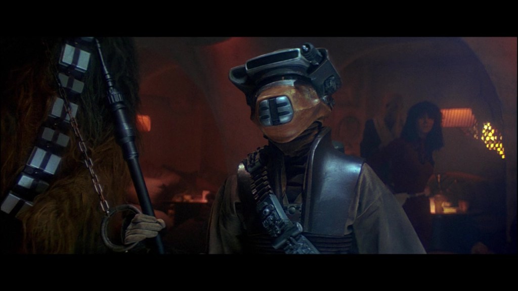 Leia (Carrie Fisher), in disguise as Boushh, attempts to curry Jabba's (Larry Ward) favor in Star Wars  Episode VI: Return of the Jedi (1983), Lucasfilm