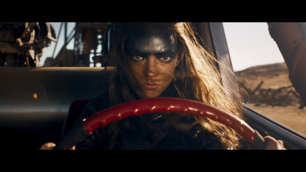 Furiosa (Anya Taylor-Joy) gets behind the wheel of a War Rig in Furiosa: A Mad Max Saga (2024), Warner Bros. Pictures