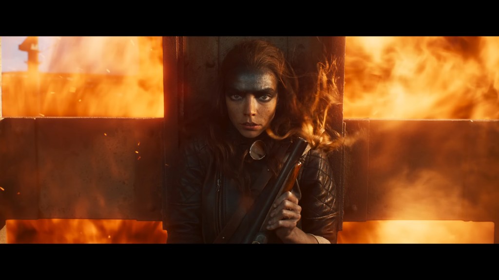 Furiosa (Anya Taylor-Joy) takes cover in Furiosa: A Mad Max Saga (2024), Warner Bros. Pictures