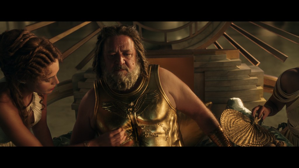 Zeus (Russell Crowe) is stunned by his defeat at the hands of Thor (Chris Hemsworth) in Thor: Love and Thunder (2022), Marvel Entertainment