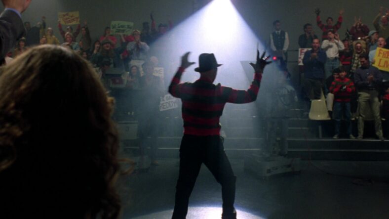 Heather Langenkamp watches Robert Englund dressed as Freddy soak up the limelight in Wes Craven's New Nightmare (1994), New Line Cinema