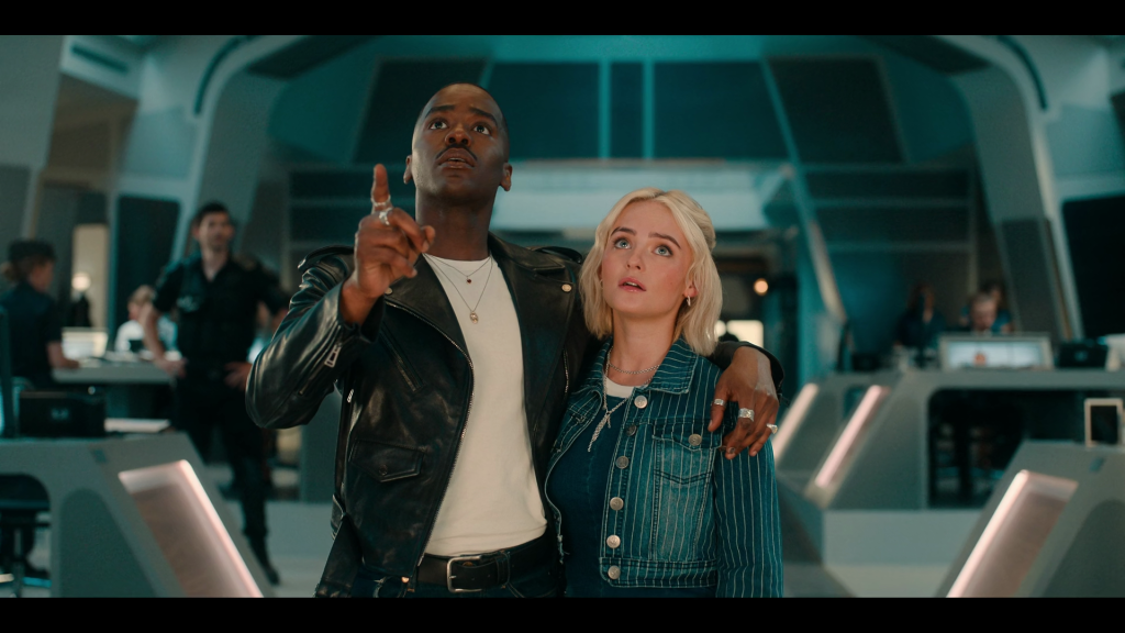 The Doctor (Ncuti Gatwa) and Ruby (Millie Gibson) arrive at UNIT headquarters in Doctor Who Series 14 Episode 7 "The Legend of Ruby Sunday" (2024), BBC