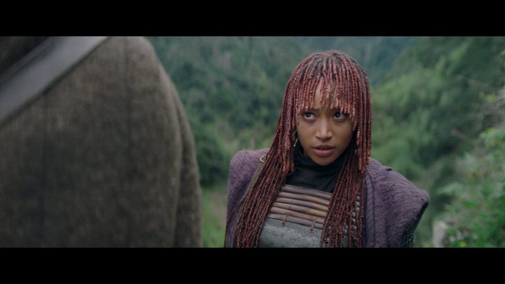 Mae (Amandla Stenberg) finds it hard to believe Qimir's (Manny Jacinto) bravado in The Acolyte Season 1 Episode 4 'Day' (2024), Disney