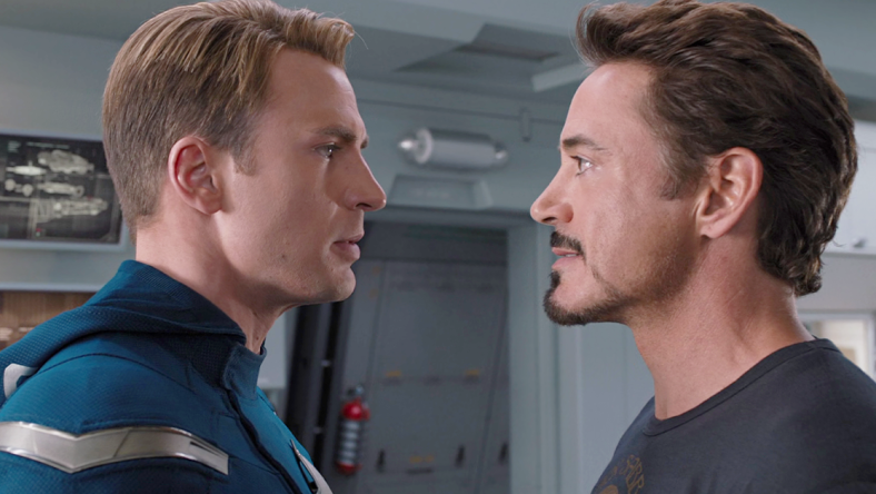 Steve Rogers (Chris Evans) and Tony Stark (Robert Downey Jr.) are at odds in The Avengers (2012), Marvel Studios