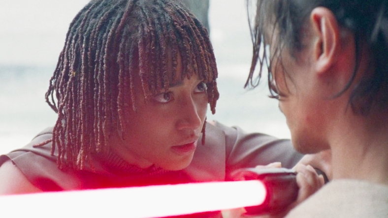 Osha (Amandla Stenberg) brings Qimir's (Manny Jacinto) lightsaber to his own throat in The Acolyte Season 1 Episode 6 'Teach/Corrupt' (2024), Disney