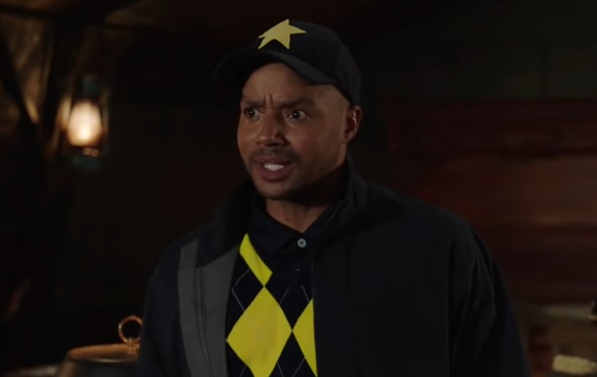 Booster Gold (Donald Faison) makes the acquaintance of the titular team in DC's Legends of Tomorrow Season 7 Episode 13 "
Knocked Down, Knocked Up" (2022), The CW