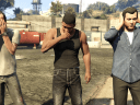 Trevor (Steven Ogg), Franklin (Shawn Fonteno) and Michael (Ned Luke) are shocked to learn that the US Government is corrupt in Grand Theft Auto V (2013), Rockstar Games