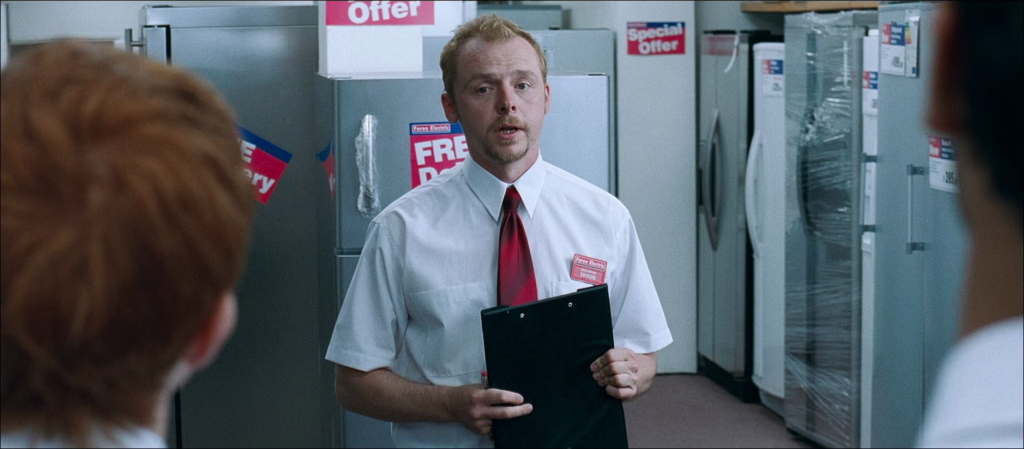 Shaun (Simon Pegg) readies up for another day of work in Shaun of the Dead (2004), Universal Pictures