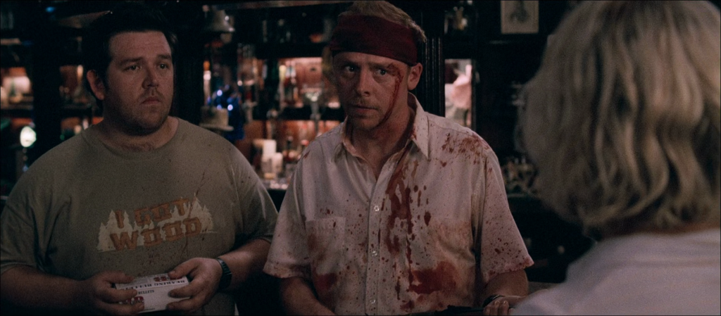 Ed (Nick Frost) and Shaun (Simon Pegg) formulate a plan of attack in Shaun of the Dead (2004), Universal Pictures