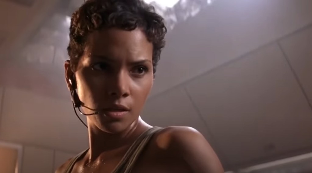 Jinx (Halle Berry) teaches the importance of reading in DIE ANOTHER DAY (2002), MGM