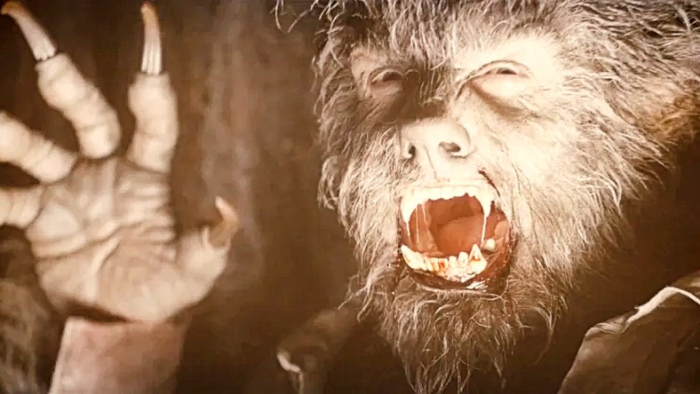 Lawrence Talbot (Benicio del Toro) attacks a frightened hunter in The Wolfman (2010), Universal Pictures