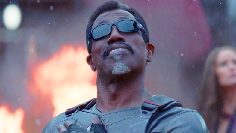 Blade (Wesley Snipes) watches on as the titular duo (Ryan Reynolds, Hugh Jackman) escape from The Void in Deadpool & Wolverine (2024), Marvel Entertainment