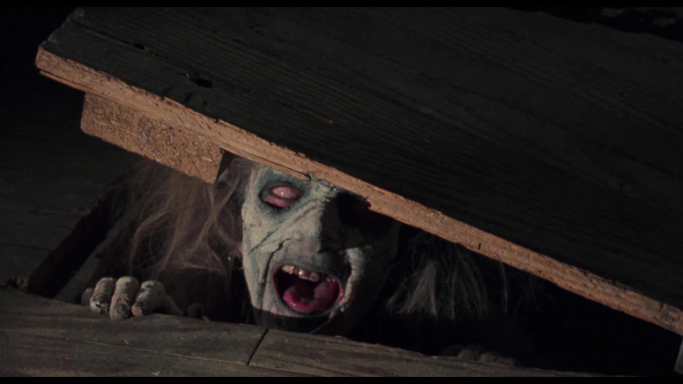 Cheryl (Ellen Sandweiss) emerges from the cabin's cellar in Evil Dead (1981), Renaissance Pictures