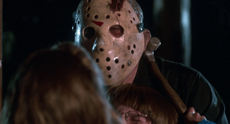 Trish (Kimberly Beck) saves Danny (Corey Feldman) by sinking a clawhammer into Jason's (Ted White) neck in Friday the 13th: The Final Chapter (1984), Paramount Pictures