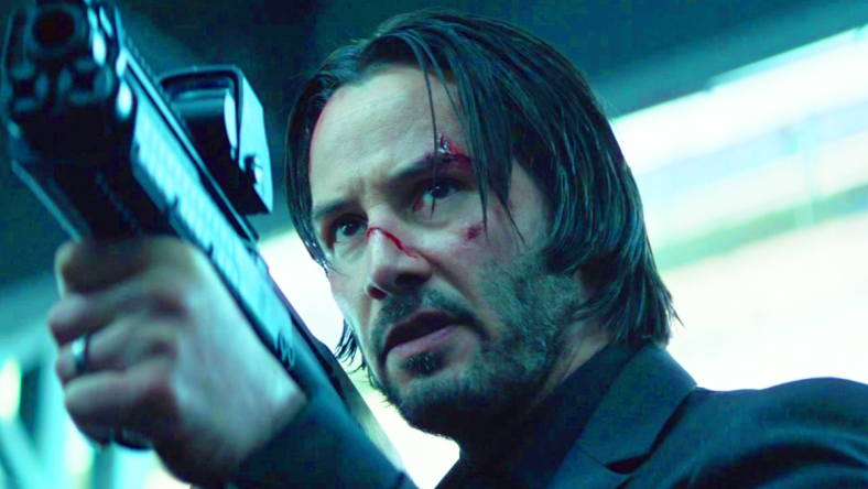 John Wick (Keanu Reeves) draws his Kel-Tec KSG on Viggo Tarasov (Michael Nyqvist) in John Wick (2014), Lionsgate