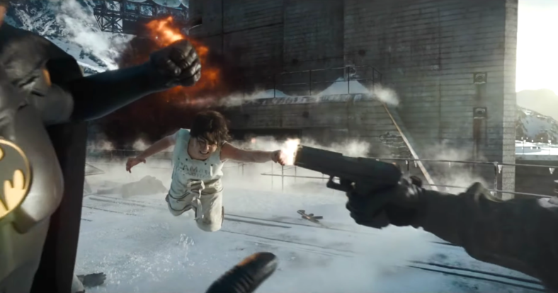 Supergirl (Sasha Calle) takes a bullet meant for Batman (Michael Keaton) in The Flash (2023), Warner Bros. Pictures