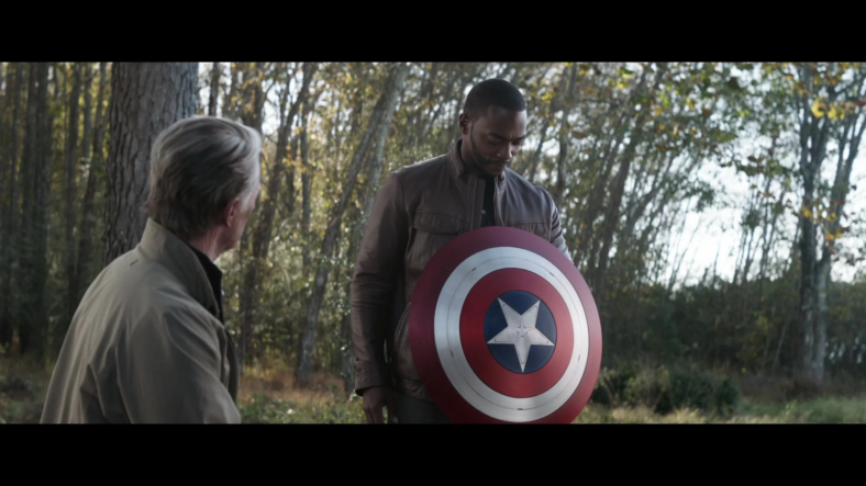 Steve Rogers (Robert Downey Jr.) hands the mantle of Captain America to Sam Wilson (Anthony Mackie) in Avengers: Endgame (2019), Marvel Entertainment