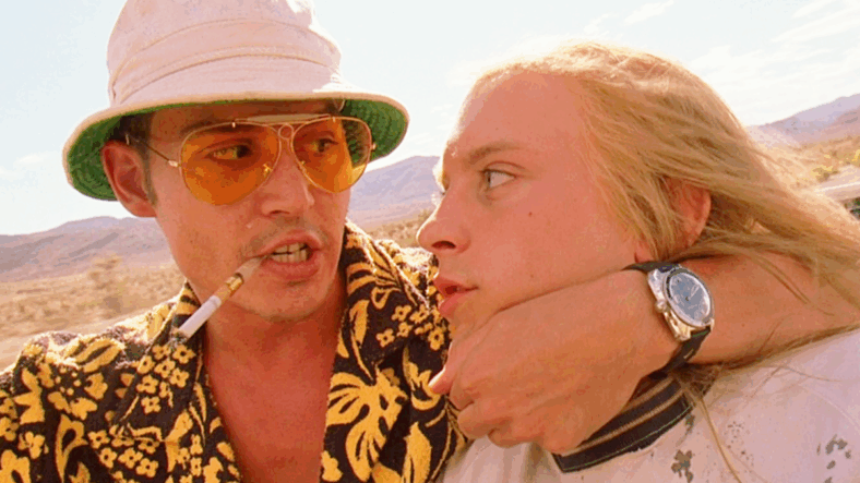 Raoul Duke (Johnny Depp) explains his and Dr. Gonzo's (Benicio Del Toro) drug-fueled plans to a young hitchhiker (Tobey Maguire) in Fear and Loathing in Las Vegas (1998), Universal Pictures