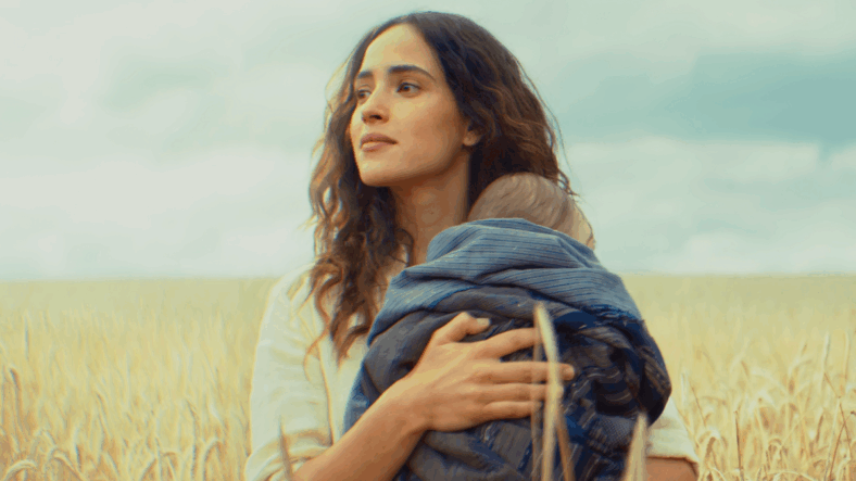 Bix Caleen (Adria Arjona) holds her newborn child in Andor Season 2 Episode 12 "Jedha, Kyber, Erso" (2025), Lucasfilm