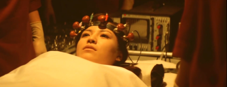 Tomoko Ai ets her head examined in Terror of Mechagodzilla (1975), Toho Co. Ltd.