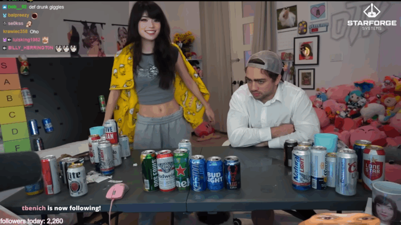 Emiru returns to the room with a blanket, after trying several beers via YouTube