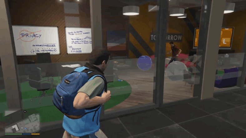 Michael De Santa (Ned Luke) walks through Lifeinvader's office in Grand Theft Auto V (2013), Rockstar Games