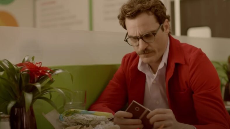 Theodore Twombley (Joaquin Phoenix) holding Samantha in Her 2013, Warner Bros Pictures