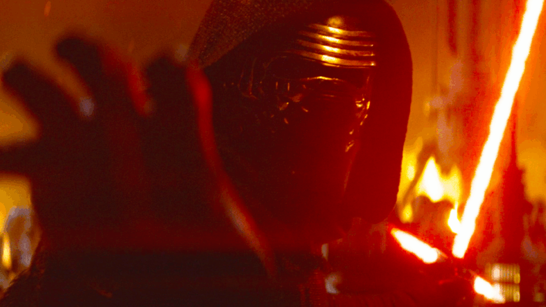 Kylo Ren (Adam Driver) uses the Force to grab a plasma bolt fired at him by Poe (Oscar Isaac) in Star Wars Episode VII - The Force Awakens (2015), Lucasfilm