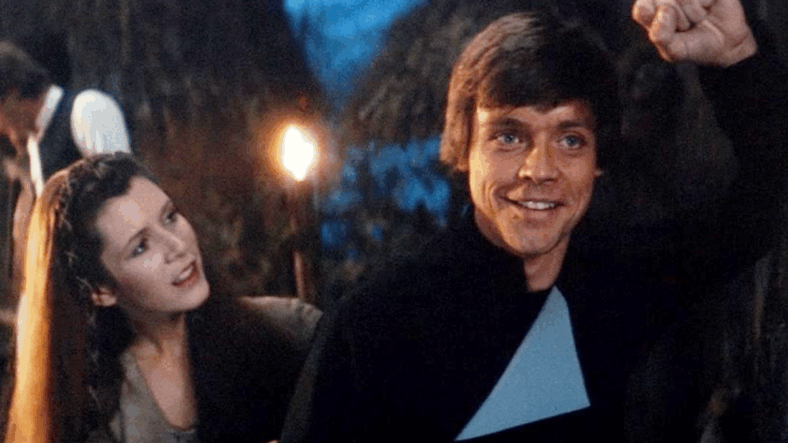 Leia (Carrie Fisher) invites a nostalgic Luke Skywalker (Mark Hamill) back to their post-victory celebration in Star Wars: Episode VI - Return of the Jedi (1985), Lucasfilm