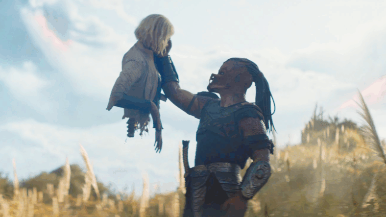 Dek (Dimitrius Schuster-Koloamatangi) makes the acquaintance of Thia (Elle Fanning) in Predator: Badlands (2025), 20th Century Studios