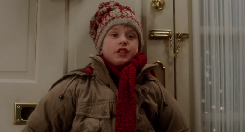 Kevin (Macaulay Culkin) swears to defend his house in Home Alone (1990), 20th Century Fox