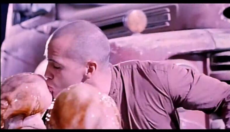 The Collector (Billy Zane) goes for the PR stunt in Tales From the Crypt Presents: Demon Knight (1995) Universal Pictures