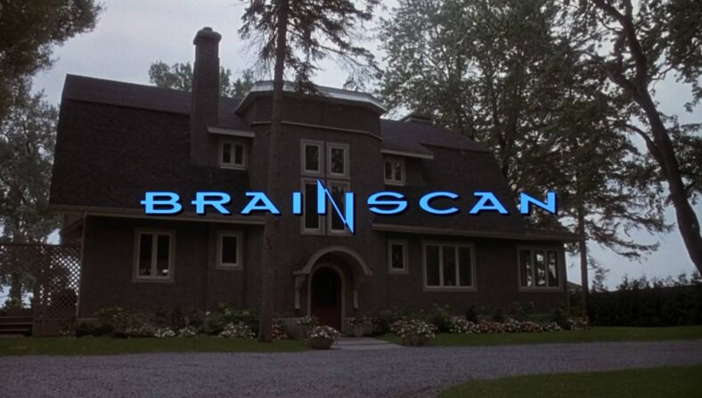 Opening credits and title complete with house establishing shot in Brainscan (1994), Triumph Films