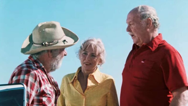 The Carters (Russ Grieve and Virginia Vincent) politely ignore the gas station owner's (John Steadman) warning in The Hills Have Eyes (1977) Vanguard