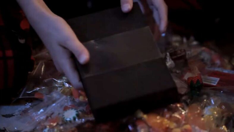 A trick-or-treater receives an ancient artifact in All Hallows' Eve (2013), Image Entertainment