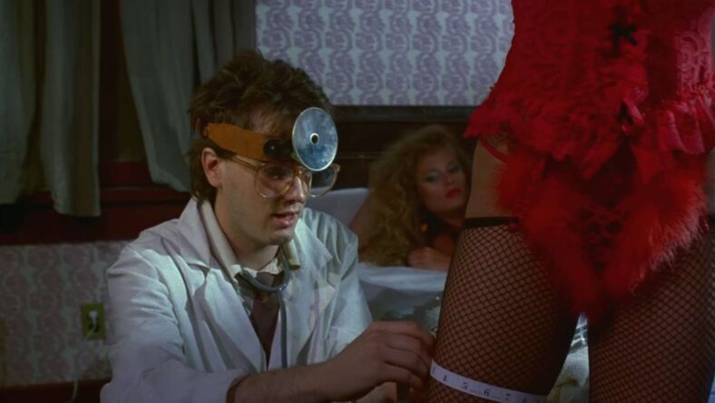 Jeffery (James Lorinz) searches for the right measurements in Frankenhooker (1990), Shapiro-Glickenhaus Entertainment