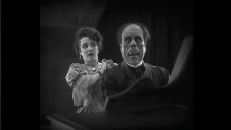 Lon Cheney realizes that catfishing only works for so long in The Phantom of the Opera (1925), Universal Pictures