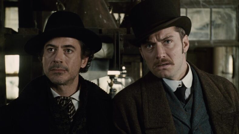 Holmes (Robert Downey Jr.) and Watson (Jude Law) reunite for one more mystery in Sherlock Holmes (2009), Warner Bros. Pictures