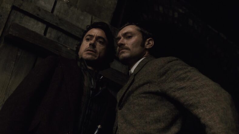 Holmes (Robert Downey Jr.) and Watson (Jude Law) thwart Lord Blackwood's (Mark Strong) occult murder plot in Sherlock Holmes (2009), Warner Bros. Pictures