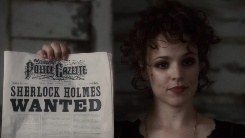 Irene Adler (Rachel McAdams) is less than amused with Holmes' (Robert Downey Jr.) public shenanigans in Sherlock Holmes (2009), Warner Bros. Pictures